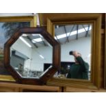 A VINTAGE GILT FRAME MIRROR. 68 x 50cms. TOGETHER WITH AN OAK OCTAGONAL EXAMPLE WITH BEVEL PLATE (