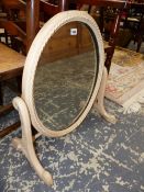 AN OVAL DRESSING TABLE MIRROR IN PINK ROPE MODELLED FRAME