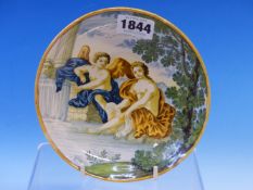 AN ITALIAN MAIOLICA DISH, POSSIBLY CASTELLI, PAINTED WITH CUPID AND VENUS SEATED BELOW A TREE BY A