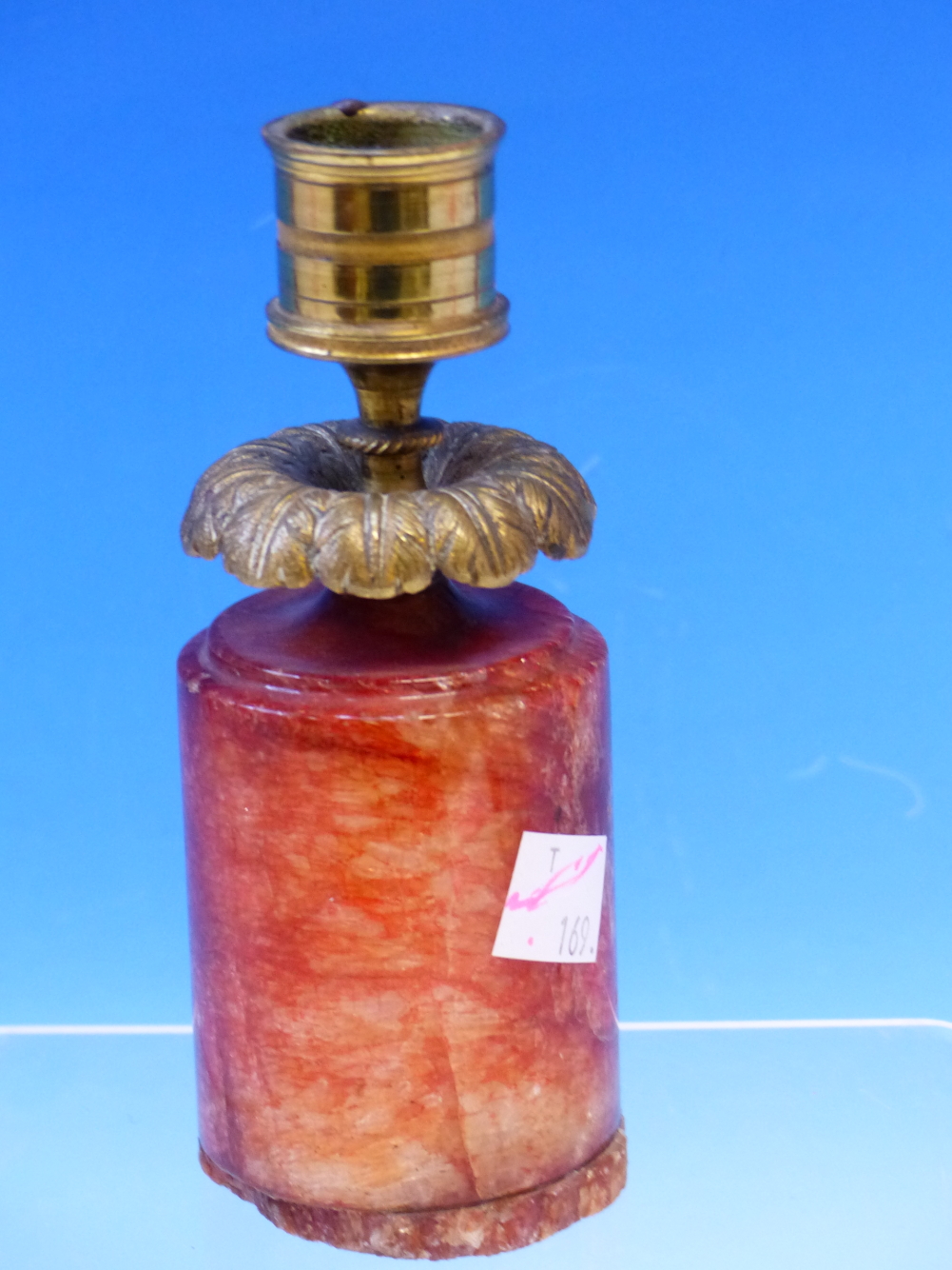 A 19th C. ORMOLU CANDLESTICK WITH FOLIATE DRIP PAN ABOVE A RED CRYSTALLINE CYLINDRICAL BASE. H 14. - Image 2 of 12