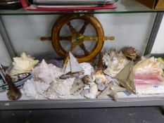 A COLLECTION OF VARIOUS SEA SHELLS,SHIPS WHEEL, MODEL BOAT ETC.