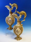 A PAIR OF FISCHER OF BUDAPEST RETICULATED BALUSTER EWERS WITH DRAGON HANDLES. H 44cms.