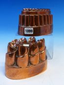 A BENHAM AND FROUDE COPPER CROWN JELLY MOULD TOGETHER WITH ANOTHER CROWN MOULD