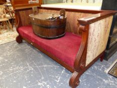 A BIEDERMEIER TASTE MAHOGANY SETTEE CARVED WITH SCROLLED ARM FRONTS AND LEGS TO THE FRONT OF THE