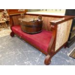 A BIEDERMEIER TASTE MAHOGANY SETTEE CARVED WITH SCROLLED ARM FRONTS AND LEGS TO THE FRONT OF THE