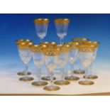 A ST LOUIS SET OF TWELVE WINE GLASS TOGETHER WITH A CLARET JUG AND STOPPER, EACH RIM AND FOOT GILT