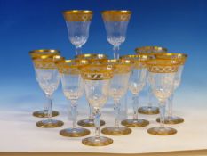 A ST LOUIS SET OF TWELVE WINE GLASS TOGETHER WITH A CLARET JUG AND STOPPER, EACH RIM AND FOOT GILT