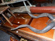 A VICTORIAN WALNUT NURSING CHAIR WITH FLORAL PIERCED AND CARVED TOP RAIL, A PAIR OF ANTLERS, A