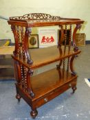A 19th C. WALNUT THREE TIER BUFFET WITH A DRAWER BELOW THE LOWEST TIER ABOVE SPINDLE LEGS ON CASTER