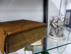 AN ART DECO LEAPING DEER MOUNTED SOAP STONE COASTER SET TOGETHER WITH AN ANTIQUE WELSH BIBLE