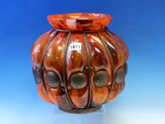A MELON SHAPED MOTTLED RED GLASS VASE, THE SHAPE FORMED BY BLOWING THE MOLTEN GLASS INTO AN EDGAR