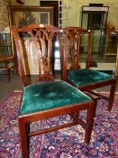 A PAIR OF GEORGE III MAHOGANY CHIPPENDALE TASTE CHAIRS, THE GREEN VELVET DROP IN SEATS ABOVE