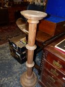 A 20th C. OAK TORCHERE. H 102cms.