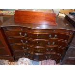 AN ANTIQUE GEORGIAN STYLE SERPENTINE MAHOGANY CHEST WITH BRUSHING SLIDE