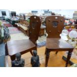 A PAIR OF 19th C. OAK HALL CHAIRS, THE SOLID BACKS WITH RECESSED SHIELDS PAINTED WITH FALCON CRESTS,