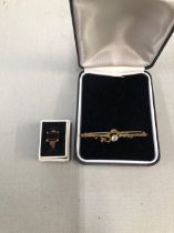 A 9ct GOLD GEMSET RING, TOGETHER WITH A 9ct GOLD GEMSET BAR BROOCH, AND A PART THREE STONE DIAMOND