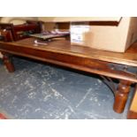 A MODERN INDIAN HARDWOOD COFFEE TABLE, THE RECTANGULAR TOP WITH METAL STUDS AT THE EDGES. W 135 x