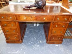 A 19th C. BURL WALNUT PEDESTAL DESK WITH BROWN LEATHER INSET TOP ABOVE A KNEEHOLE DRAWER FLANKED