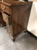 A GEORGE III MAHOGANY KNEEHOLE DESK, A LONG APRON DRAWER ABOVE THE CUPBOARD RECESSED IN THE KNEEHOLE