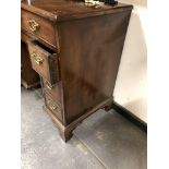 A GEORGE III MAHOGANY KNEEHOLE DESK, A LONG APRON DRAWER ABOVE THE CUPBOARD RECESSED IN THE KNEEHOLE