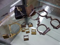 THREE VARIOUS PAIRS OF HANDCUFFS TO INCLUDE ONE PAIR LEATHER CASE TOGETHER WITH SIX PADLOCKS WITH LE