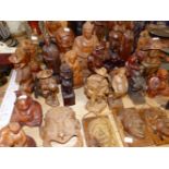 A COLLECTION OF VARIOUS EASTERN CARVED FIGURINES.