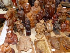 A COLLECTION OF VARIOUS EASTERN CARVED FIGURINES.