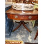 A 19th C. MAHOGANY DROP FLAP OVAL TABLE WITH A DRAWER TO ONE END ABOVE THE TURNED COLUMN ON FOUR