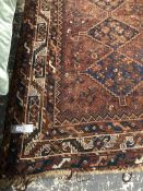 AN ANTIQUE PERSIAN SHIRAZ RUG