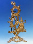 A LATE 18th C. SILVERED METAL WATCH STAND, THE COCKEREL SURMOUNT ABOVE THE FIGURE OF A MALE FLAUTIST