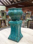 A LATE 19th C. MAJOLICA PLANTER AND STAND, THE TURQUOISE GLAZE OVER FEATHERED SCROLL AND SHELL