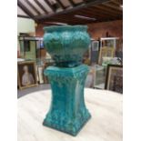 A LATE 19th C. MAJOLICA PLANTER AND STAND, THE TURQUOISE GLAZE OVER FEATHERED SCROLL AND SHELL