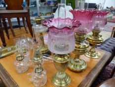 EIGHT VARIOUS VICTORIAN OIL LAMPS AND FOUR CHAMBER LAMPS ALL WITH SHADES.