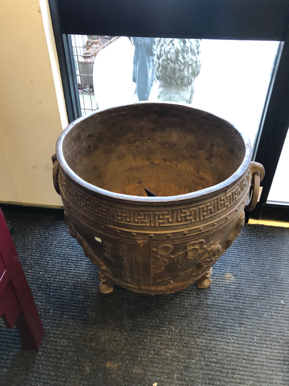 A CHINESE CAST IRON RING HANDLED CAULDRON, THE ROUNDED SIDES CAST WITH FIGURES AND INSCRIPTIONS - Image 7 of 9