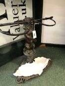 A 19th C. CAST IRON STICK STAND, POSSIBLY COALBROOKDALE, IN THE FORM OF A BROWN TINTED CHIHUAHUA