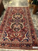 AN ANTIQUE PERSIAN SHIRAZ RUG. 180x125cms TOGETHER WITH ANOTHER PERSIAN RUG. 250x141 (2)