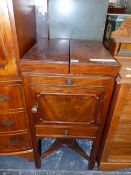 A GEORGE III MAHOGANY NIGHT TABLE, THE CENTRALLY SPLIT LID OVER A BOWL RECEIVER, CUPBOARD, A