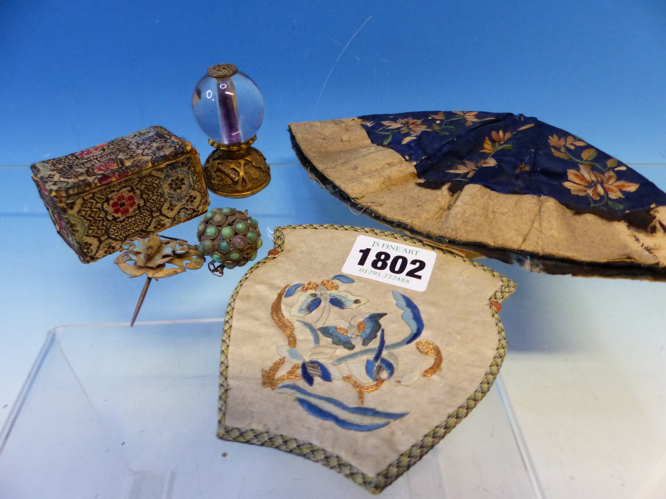 A CHINESE FLORAL EMBROIDERED BLUE CAP, A CHINESE WHITE VASE SHAPED PURSE EMBROIDERED WITH