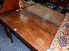 A REGENCY MAHOGANY DINING TABLE, THE TWO RECTANGULAR ENDS ROUNDED ABOVE THE APRON, THE TURNED