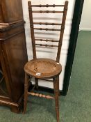 A PAIR OF 19th C. STAINED WOOD CORRECTION CHAIRS, EACH BACK WITH SIX RING TURNED HORIZONTAL BARS,