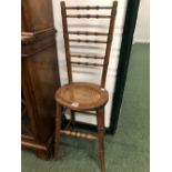 A PAIR OF 19th C. STAINED WOOD CORRECTION CHAIRS, EACH BACK WITH SIX RING TURNED HORIZONTAL BARS,