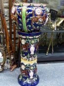 A LATE 19th C. MAJOLICA PLANTER AND STAND DECORATED IN RELIEF WITH PAIRS OF FANTASTIC CAT