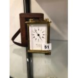 A WOODFORD BRASS CASED CARRIAGE CLOCK AND AN ASSOCIATED OUTER LEATHER TRAVEL CASE.