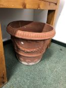 A PAIR OF LARGE TERRACOTTA PLANTERS.