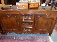 A 19th C. FRENCH PROVINCIAL OAK DRESSER BASE, THE CENTRAL THREE DRAWERS FLANKING BY CUPBOARDS WITH S