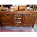 A 19th C. FRENCH PROVINCIAL OAK DRESSER BASE, THE CENTRAL THREE DRAWERS FLANKING BY CUPBOARDS WITH S