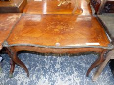 A LATE 19th C. FRENCH FLORAL MARQUETRIED KING WOOD TABLE WITH ORMOLU EDGES TO THE SERPENTINE, APRON