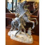 A PAIR OF SPELTER MARLEY HORSE FIGURES.