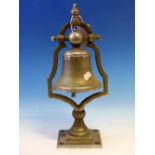 A CHROME PLATED BELL MOUNTED ABOVE A SOCLE AND SQUARE FOOT. H 39cms.