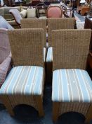 A SET OF FOUR BASKET WEAVED CHAIRS WITH UPHOLSTERED SEATS